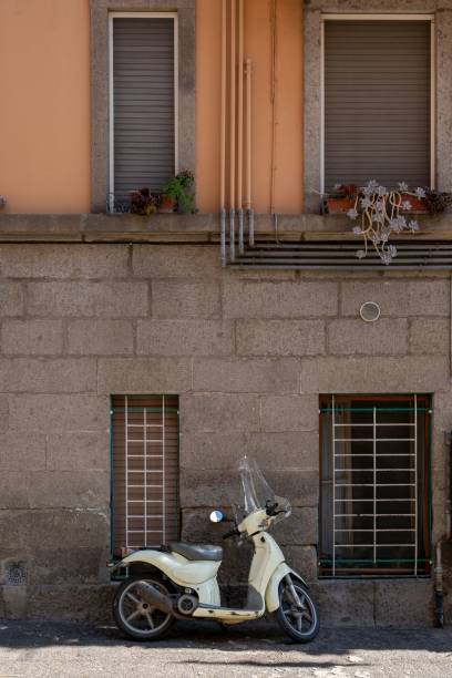 istock White moped parked outside a building in Pitigliano, Italy. 1489113665