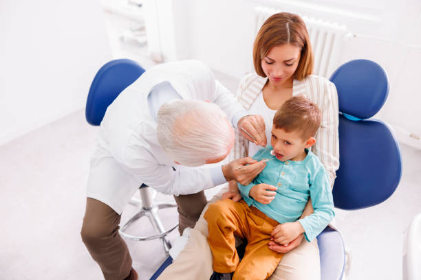 istock Little boy brave at dentist checkup 1489114653