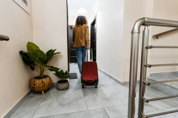istock Young Woman Entering A Hotel Room 1489115577