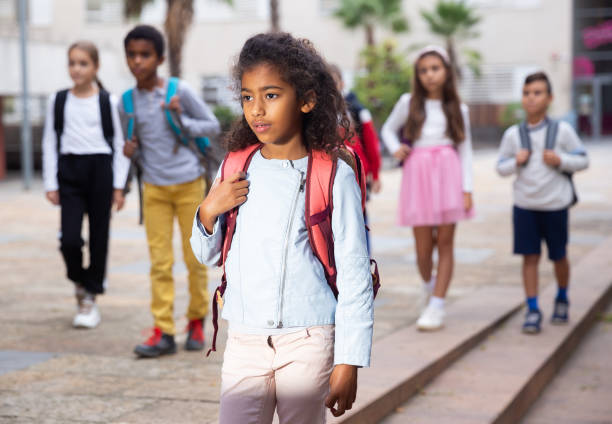 istock Curly tween girl walking to school campus after lessons 1489118478