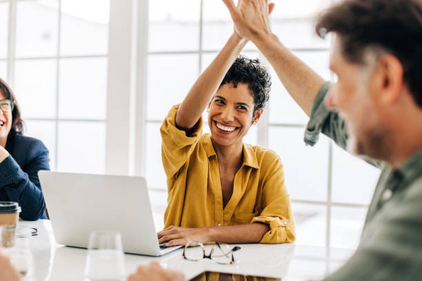 istock Business people celebrating success in an office 1489120904