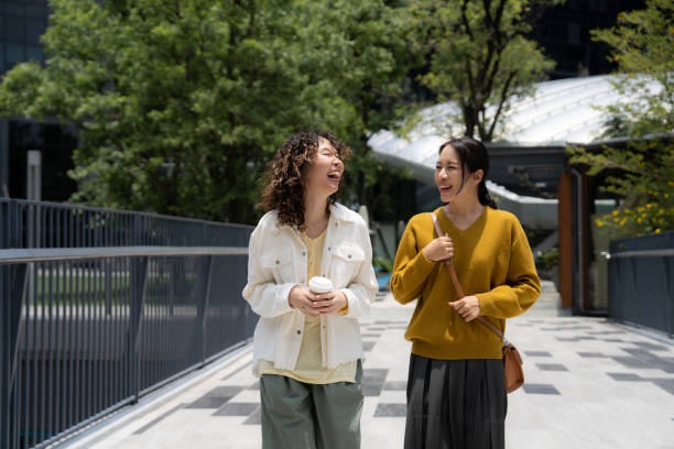 istock Female and friends standing and talking with smiles 1489121799