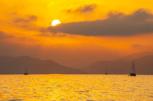 istock Yacht anchored at sunset 1489123602