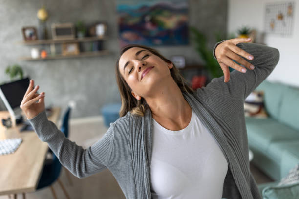 istock Woman having fun dancing to music at home 1489123701