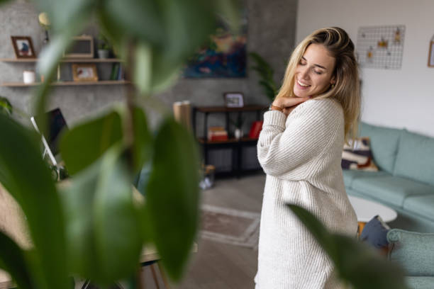 istock Young woman dancing at home 1489123992
