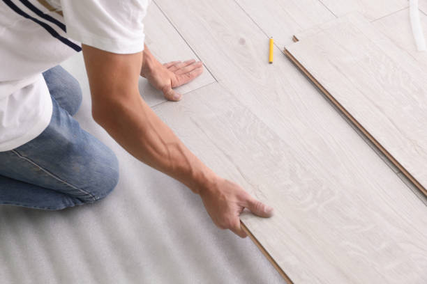 istock Man installing new laminate flooring, closeup view 1489124695