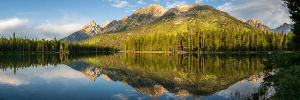istock Panorama of Grand Teton Range Reflecting in String Lake 1489124746