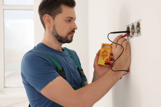 istock Electrician in uniform with tester checking voltage indoors 1489125318
