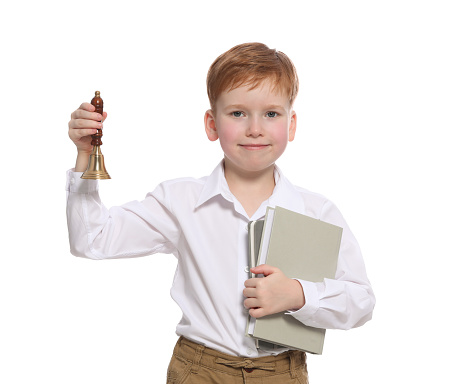 Pupil with school bell and books on white background