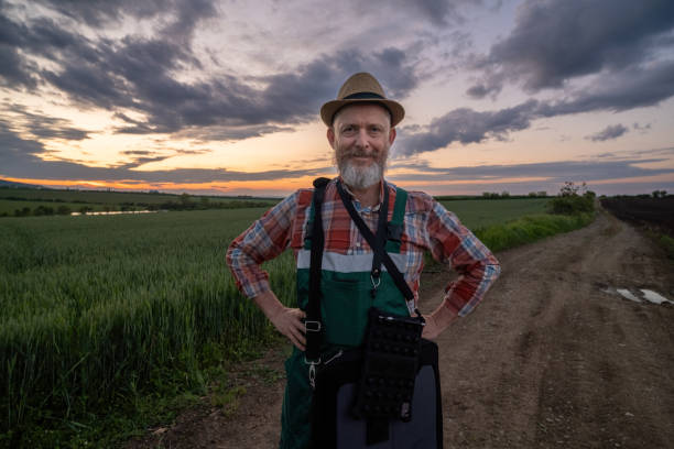 istock Farmer in a wheat field at sunset. 1489126781