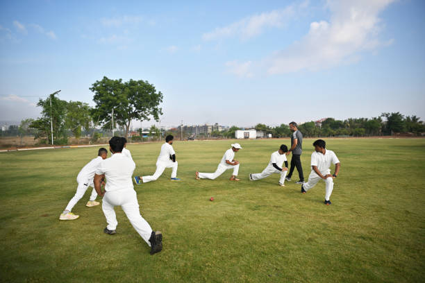 istock Coach taking warm up routine of team players before cricket match 1489128591