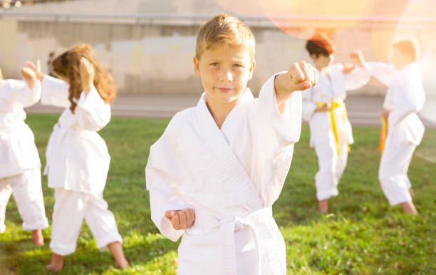 istock Boy throws a punch at martial arts practice 1489129163
