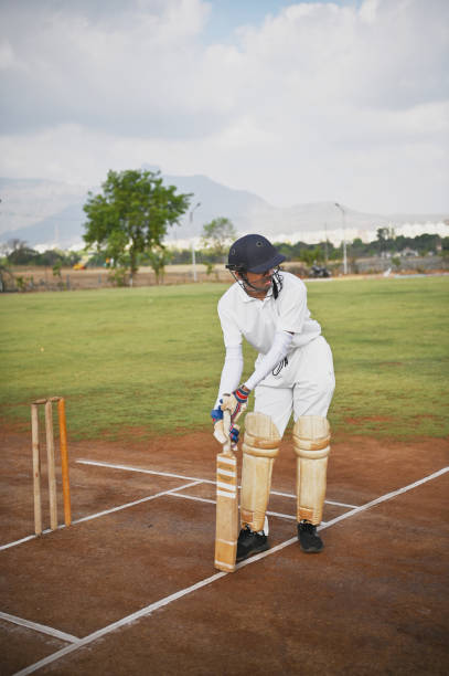 istock Cricket batsman on the field, warming up before the match 1489129305