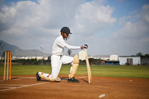 istock Cricket batsman on the field, warming up before the match 1489129346