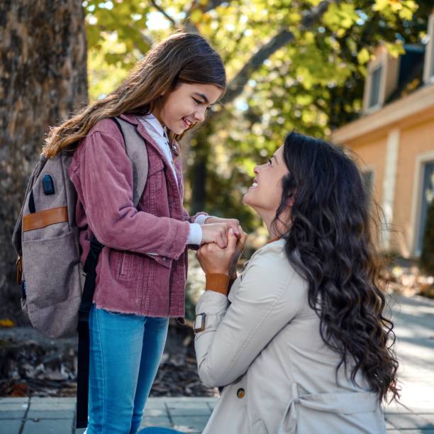 Daughter and mum smiling at each other