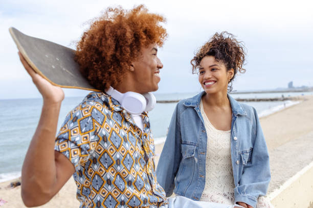 istock Beautiful young couple hanging out on the beach 1489131338