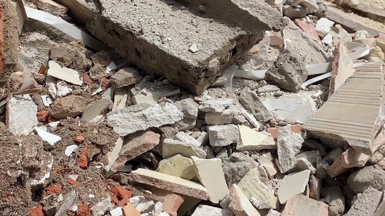 Broken tiles and rubble in container