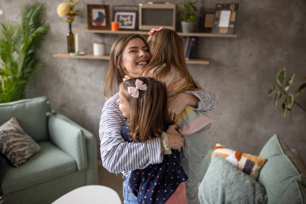 istock Mother playing with her daughters at home 1489135545