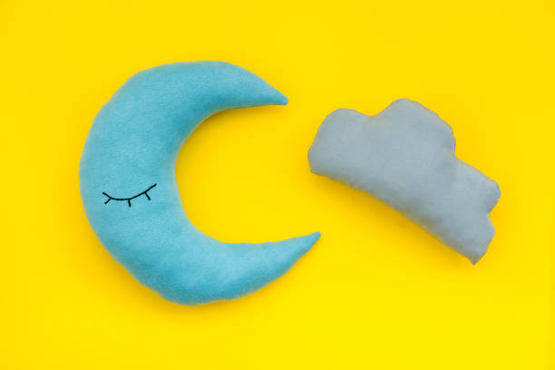 istock Insomnia concept background with moon pillow for bed 1489139268