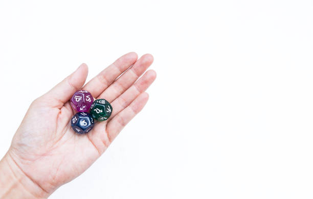 istock Dice divination in girl hand isolate on white background, astrological dices fortune telling divination tools 1489139411