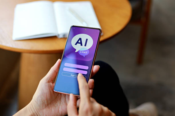istock The woman is using her smartphone for a close-up chat with an AI chatbot to help her write content. 1489140997