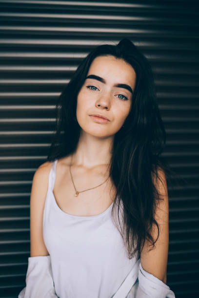 istock Beautiful young woman wearing white top 1489141198