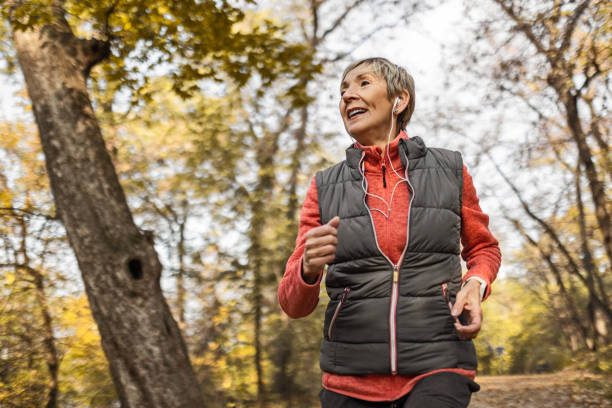 istock Senior woman jogging in park 1489141492