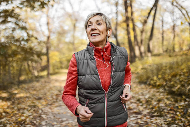 istock Senior woman jogging in park 1489141600