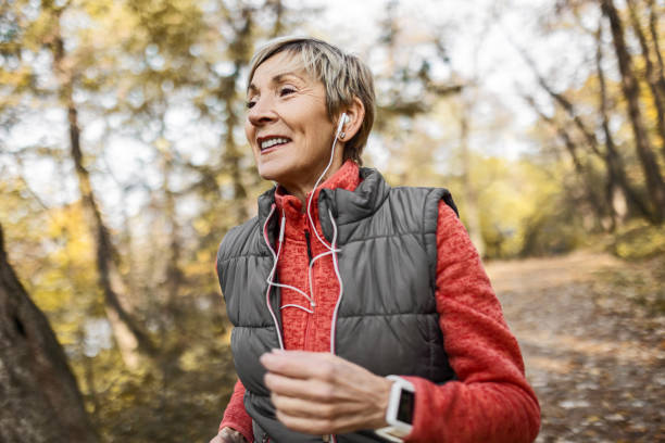 istock Senior woman jogging in park 1489141633