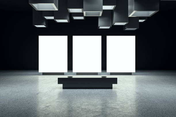 istock Front view on three white blank digital screens with space for advertising or campaign in abstract dark exhibition hall interior with concrete floor on background. 3D rendering, mockup 1489142892