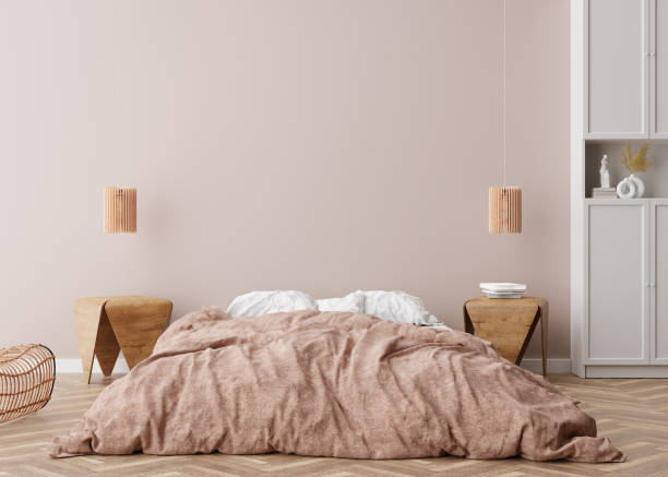 istock Empty wall in modern bedroom. Mock up interior in scandinavian, boho style. Empty, copy space for your picture, poster, artwork. Bed, rattan armchair. 3D rendering. 1489145107