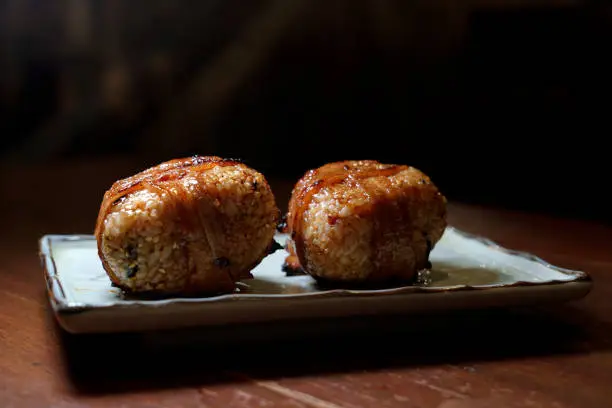 Yaki Onigiri are Japanese grilled rice balls covered in savory soy sauce. With a crispy crust on the outside and soft sticky rice on the inside
