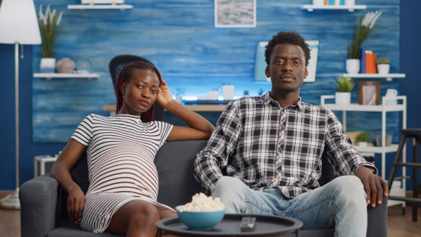 istock Black married couple with pregnancy talking on video call 1489157178