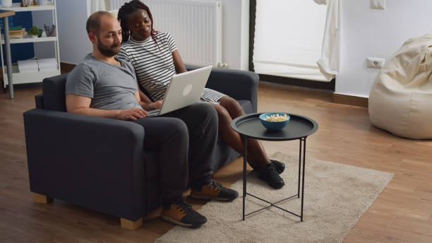 istock Modern interracial couple waving on video call conference 1489158003