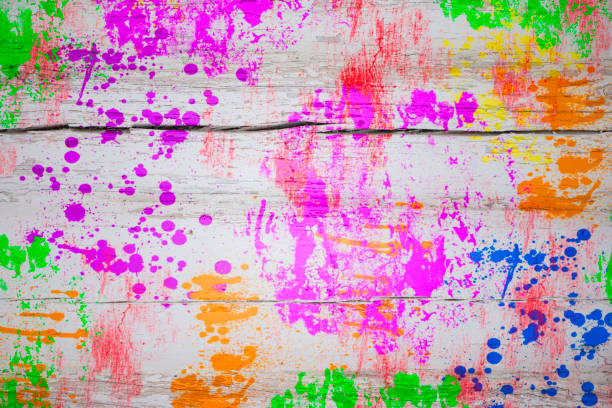 istock Multicolored paint stains on a wooden board. Bright colorful background. 1489158720