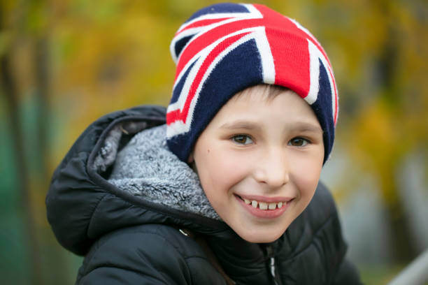 istock Happy child in a hat with the British flag. 1489160524