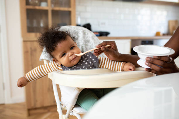istock Mother feeding her baby at home 1489161453