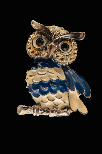 Owl statuette isolated on black background, close-up Owl statuette isolated on black background, close-up antique chinese dolls pictures stock pictures, royalty-free photos & images