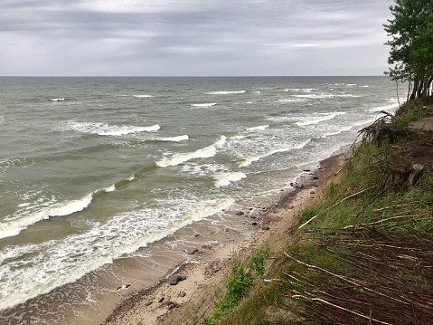 Baltic sea beach photography, Lithuanian landscape of Curonian spit in Nida. Pajūrio regioninis parkas, national park in Kukuliškiai. Traveling photo, tourism concept picture with cloud and storm weather.