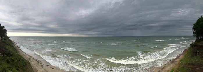 Baltic sea beach panoramic photography, Lithuanian landscape of Curonian spit in Nida. Pajūrio regioninis parkas, national park in Kukuliškiai. Traveling panorama photo, tourism concept picture with cloud and storm weather.