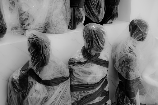Group of artificial mannequins wrapped..