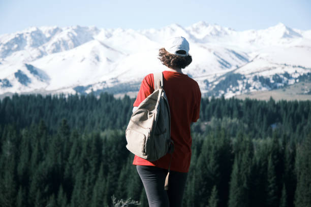 istock Female hiker is looking around in mountains 1489165705