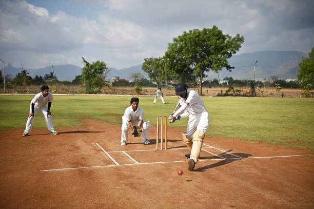 istock A front view of a focused batsman in action taking long shot 1489166007