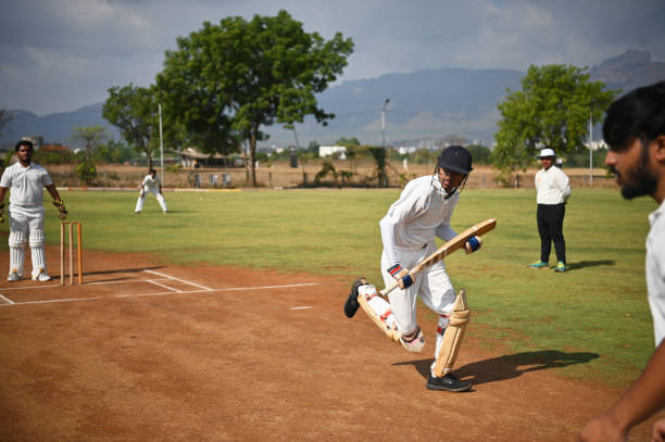istock Batsman taking run after hitting the ball during cricket match 1489166342