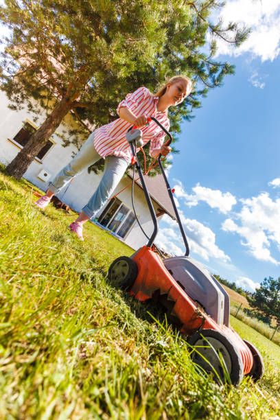 istock Woman mowing green grass 1489166456