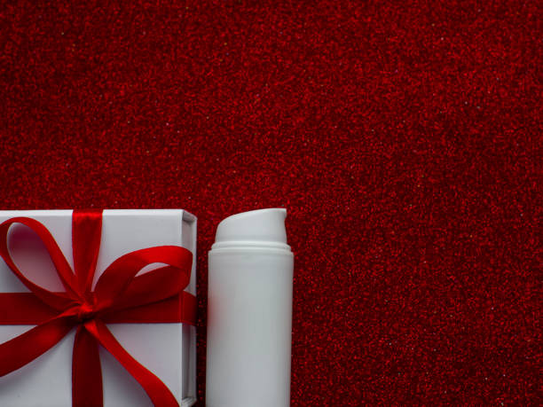 istock White jar with face cream is on red paper background 1489166744