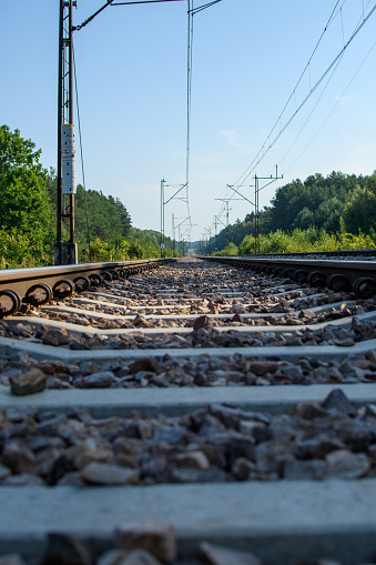 low perspective view of train tracks with a forward view of the route