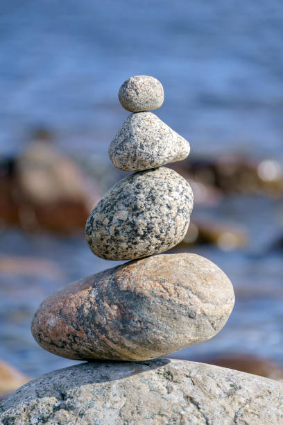 istock Pyramid of stones. Unstable balance of stone objects. 1489169894