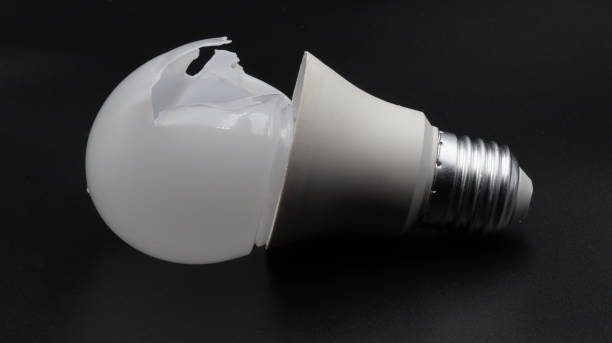 istock a white led bulb with a broken top on a black background. close-up. 1489170287