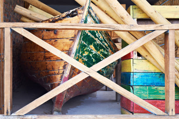 istock Old wooden boat in warehouse 1489170671